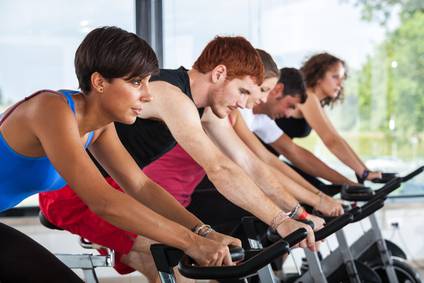 Group of People Cycling at Gym